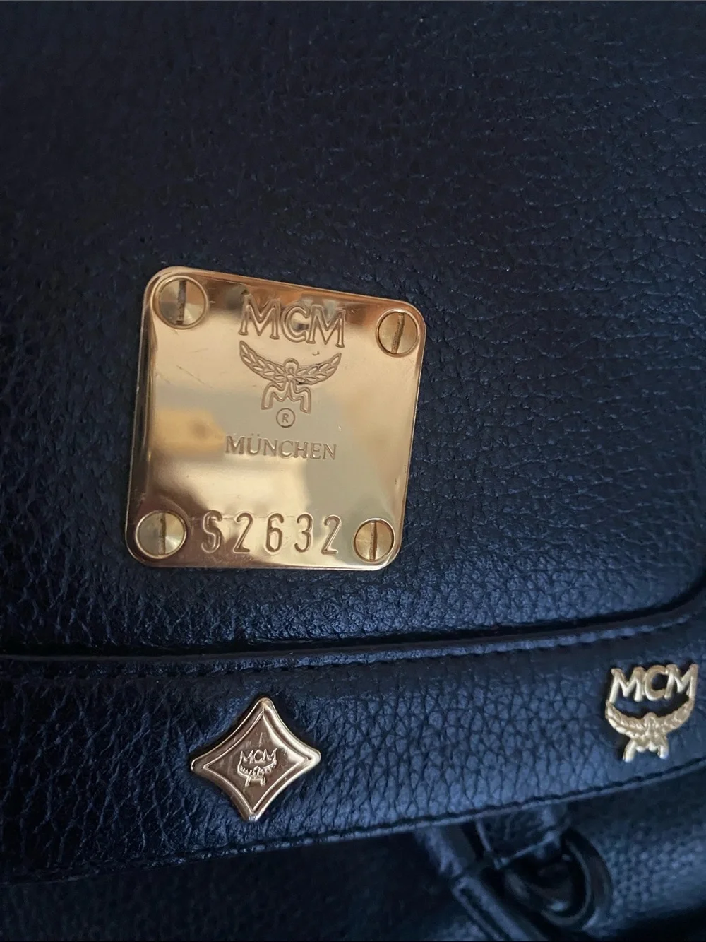 MCM Black Pebbled Leather Backpack with Gold Emblem Hardwarer